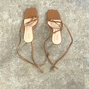 Light brown, skinny high heel with straps. Size 5 Women UK and 7 in Women’s US.